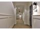 Long hallway with decorative molding, tiled floor, and illuminated unit numbers, creating an inviting and well-maintained atmosphere at 625 Piedmont Ne Ave # 2004, Atlanta, GA 30308