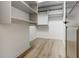 Spacious walk-in closet with shelving and wood-look floors at 625 Piedmont Ne Ave # 2004, Atlanta, GA 30308