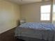 Neutral bedroom with carpet, bed, and a window providing natural light at 4620 Grand Central Pkwy, Decatur, GA 30035