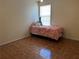 Bedroom with hardwood floors, window, and bed at 4620 Grand Central Pkwy, Decatur, GA 30035