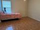 Bedroom with hardwood floors, window, and space for a bed at 4620 Grand Central Pkwy, Decatur, GA 30035