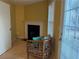 Cozy living room featuring a fireplace, light wood flooring, and bright natural light from a sliding glass door at 4620 Grand Central Pkwy, Decatur, GA 30035