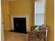 Cozy living room featuring a fireplace, light wood flooring, and bright natural light from a sliding glass door at 4620 Grand Central Pkwy, Decatur, GA 30035