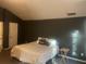 Bedroom featuring a vaulted ceiling, dark walls, carpet and a bed at 4620 Grand Central Pkwy, Decatur, GA 30035