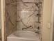 Tub-shower combo with marble surround, rainfall shower head and metal grab bars at 4620 Grand Central Pkwy, Decatur, GA 30035