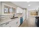 Modern kitchen featuring white cabinets, granite countertops, subway tile backsplash, and stainless steel appliances at 6715 Knollwood Cir, Douglasville, GA 30135