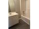 Bathroom features tile flooring, a white vanity, and a tiled shower and tub at 3305 Wickum Sw Rd, Atlanta, GA 30349