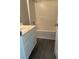 Bathroom features tile flooring, a white vanity, and a tiled shower and tub at 3305 Wickum Sw Rd, Atlanta, GA 30349