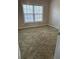 Bright bedroom featuring neutral paint, plush carpeting, and a large window offering ample natural light at 3305 Wickum Sw Rd, Atlanta, GA 30349