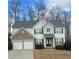 Charming two-story home with a brick facade, attached two-car garage, and well-maintained landscaping at 3305 Wickum Sw Rd, Atlanta, GA 30349