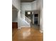 Inviting foyer with hardwood floors, staircase, and high ceilings, creating an open and airy entrance at 3305 Wickum Sw Rd, Atlanta, GA 30349