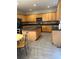 Modern kitchen with granite countertops, island, ample cabinetry, and stainless steel appliances for cooking at 3305 Wickum Sw Rd, Atlanta, GA 30349