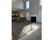 Bright living room featuring a fireplace, carpet flooring, large windows, and an open layout at 3305 Wickum Sw Rd, Atlanta, GA 30349