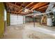 Unfinished basement with exposed ceiling and concrete floor at 664 Church Nw St, Atlanta, GA 30318