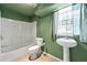 Bathroom with shower, sink, toilet and natural light from window at 664 Church Nw St, Atlanta, GA 30318