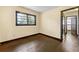 Comfortable bedroom featuring hardwood floors and a window, providing natural light at 664 Church Nw St, Atlanta, GA 30318