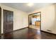 Cozy bedroom with hardwood floors and a doorway leading to other areas of the home at 664 Church Nw St, Atlanta, GA 30318