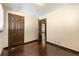 Bedroom featuring hardwood floors, doorway, and neutral-colored walls at 664 Church Nw St, Atlanta, GA 30318