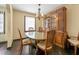 Cozy dining room with a classic china cabinet and hardwood floors at 664 Church Nw St, Atlanta, GA 30318