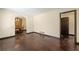Spacious living room with gleaming hardwood floors and an archway leading to the dining area at 664 Church Nw St, Atlanta, GA 30318