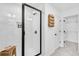 Modern bathroom showcases a glass enclosed shower, white subway tiles, dark hardware, and a convenient shower niche at 224 Village Overlook # K3, Canton, GA 30114