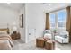 Sunlit bedroom featuring a sitting area and a light color scheme at 224 Village Overlook # K3, Canton, GA 30114