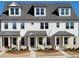 A row of new townhomes with charming exteriors, covered porches, and manicured front yards at 224 Village Overlook # K3, Canton, GA 30114