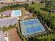 Aerial view of the community's swimming pool, tennis court, and playground amenities at 5750 Palmtree Pass, Cumming, GA 30040