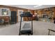 Basement featuring wood paneling, stone fireplace, and large carpeted area at 583 Mount Zion Rd, Oxford, GA 30054
