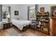 A bedroom featuring a bed, bookcase, and hardwood floors at 583 Mount Zion Rd, Oxford, GA 30054