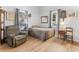 Bedroom showcasing hardwood floors, two windows, neutral walls, and a twin bed at 583 Mount Zion Rd, Oxford, GA 30054