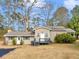 Charming single-story home featuring a cozy front porch and a well-maintained lawn at 583 Mount Zion Rd, Oxford, GA 30054
