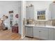 A view of the kitchen featuring stainless steel appliances, white countertops, and hardwood floors at 583 Mount Zion Rd, Oxford, GA 30054