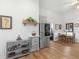 A partial view of the bright kitchen area from the dining area with hardwood floors at 583 Mount Zion Rd, Oxford, GA 30054