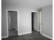 The bedroom doorway leads to bathroom, with two additional doors, and light-grey painted walls at 814 Humphries Sw St, Atlanta, GA 30310