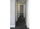 Hallway with grey walls and dark wood-look flooring leads to other rooms of the home at 814 Humphries Sw St, Atlanta, GA 30310