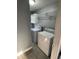 Convenient laundry room with washer, dryer, and overhead shelving for storage at 814 Humphries Sw St, Atlanta, GA 30310