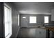 Open living space with multiple windows, tiled floors, and freshly painted walls at 814 Humphries Sw St, Atlanta, GA 30310