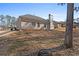 The backyard includes a well-maintained lawn and a view of the home's brick exterior at 106 Saint Margrit Cir, Stockbridge, GA 30281