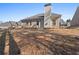 The backyard includes a well-maintained lawn and a view of the home's brick exterior at 106 Saint Margrit Cir, Stockbridge, GA 30281