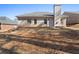 The backyard includes a well-maintained lawn and a view of the home's brick exterior at 106 Saint Margrit Cir, Stockbridge, GA 30281