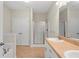 Bright bathroom featuring double sink vanity, glass shower and tile flooring at 106 Saint Margrit Cir, Stockbridge, GA 30281