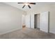 Neutral bedroom featuring a large closet, doorway, and ceiling fan at 106 Saint Margrit Cir, Stockbridge, GA 30281