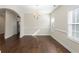 Bright dining room features hardwood floors, a chandelier, and modern trim at 106 Saint Margrit Cir, Stockbridge, GA 30281