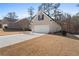 Well-maintained single-story brick home featuring a two-car garage and long driveway at 106 Saint Margrit Cir, Stockbridge, GA 30281