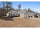 Attractive single-story brick home with a well-manicured lawn and an attached two-car garage at 106 Saint Margrit Cir, Stockbridge, GA 30281