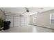 A two car garage with a window and white garage door at 106 Saint Margrit Cir, Stockbridge, GA 30281