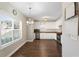 Bright kitchen featuring white cabinets, stainless steel appliances, and hardwood floors at 106 Saint Margrit Cir, Stockbridge, GA 30281