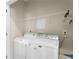 The laundry room features a modern, white washer and dryer at 106 Saint Margrit Cir, Stockbridge, GA 30281
