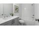 Bathroom with white subway tile surround, gray vanity with quartz top, and modern chrome fixtures at 2380 Edgar Park Pl # 101, Duluth, GA 30096